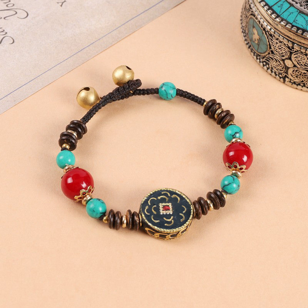 Red beads space turquoise stones, balanced and elegant.