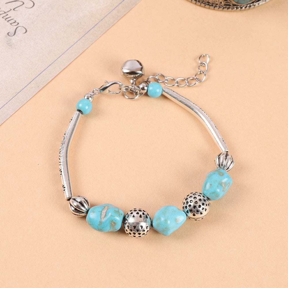 Single turquoise bead with silver chain, simple and elegant.