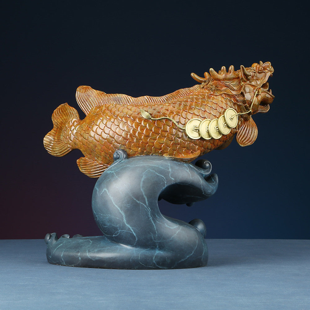 Traditional Chinese bronze dragon fish sculpture adorned with lucky coins, positioned on a wave - shaped base against a dark background 01