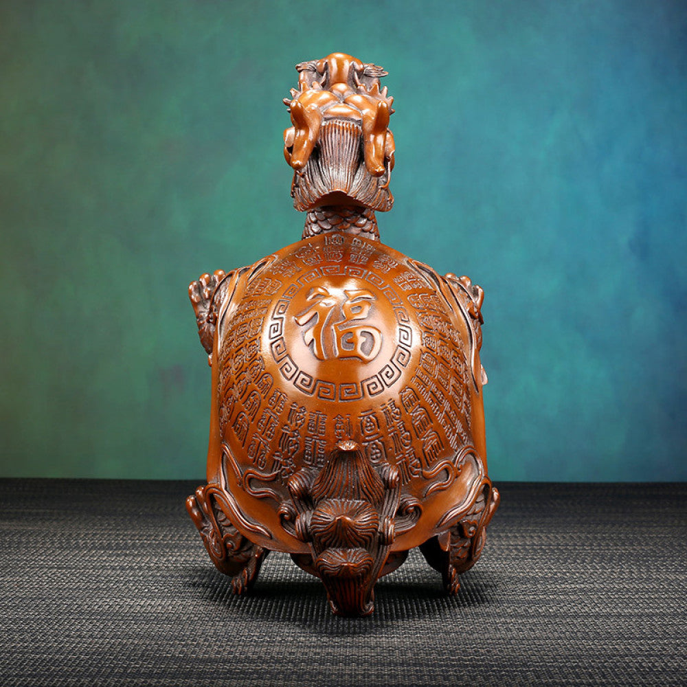 Traditional Chinese bronze dragon turtle statue with intricate inscriptions on its shell, displayed against a teal gradient background 03