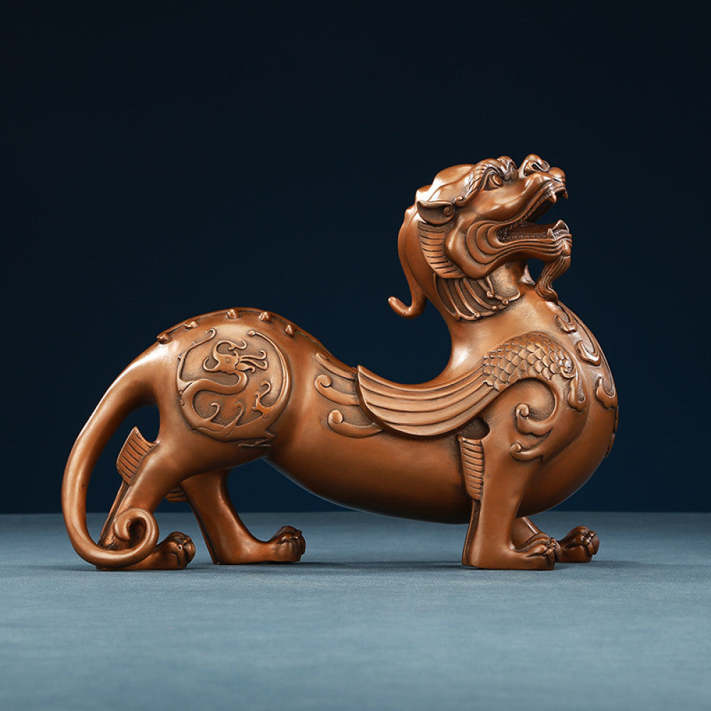 Traditional Chinese bronze Pixiu statue with intricate floral carvings, displayed against a dark blue background 01