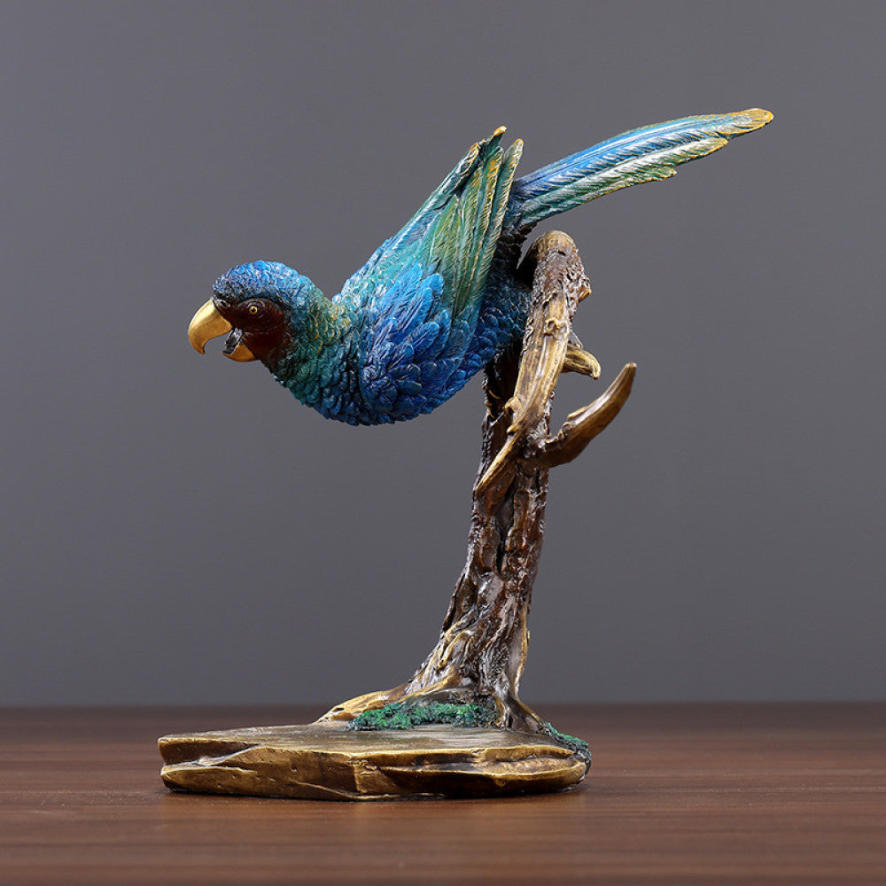 Colorful traditional Chinese parrot statue with blue and green hues, perched on a branch - shaped base, set against a gray background
