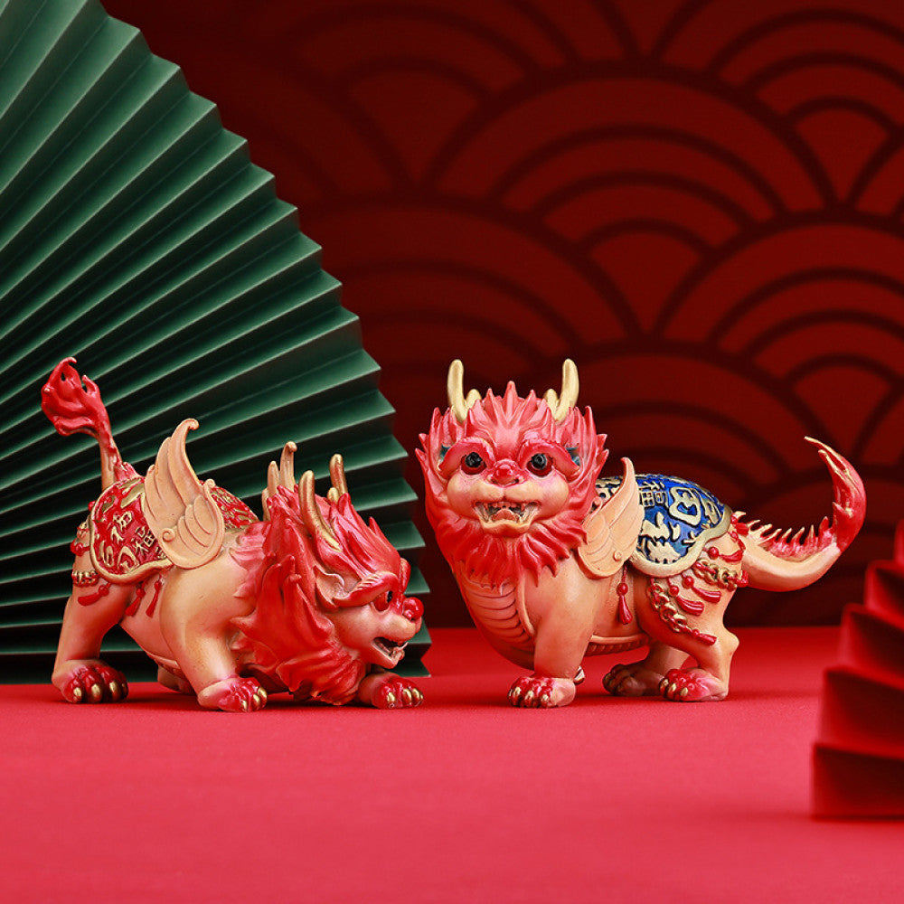 Pair of colorful traditional Chinese Qilin statues with red and blue - golden details, placed against a red background with Chinese fan decoration 02