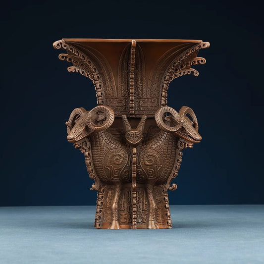 Traditional Chinese four - sheep bronze zun vessel with intricate carvings, isolated on white background 01