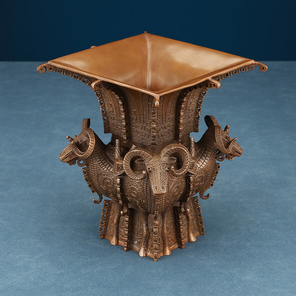 Traditional Chinese four - sheep bronze zun vessel with intricate carvings, isolated on white background 04