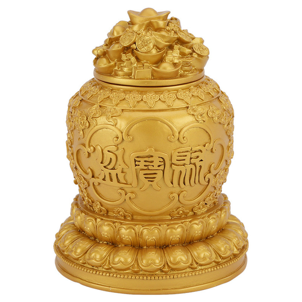 Golden Chinese treasure bowl decoration with intricate carvings and characters, isolated on white background