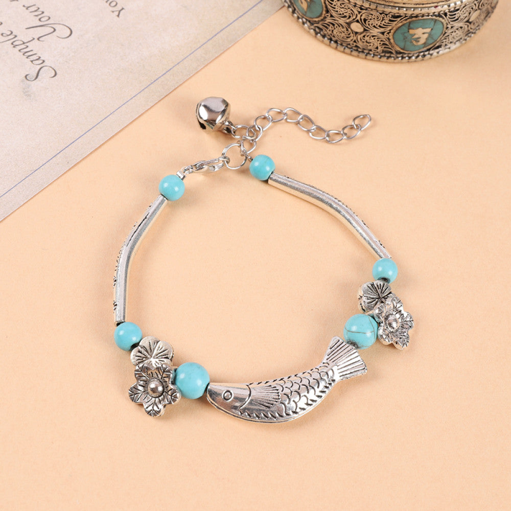 Silver fish pendant with turquoise beads, vintage ethnic vibe.