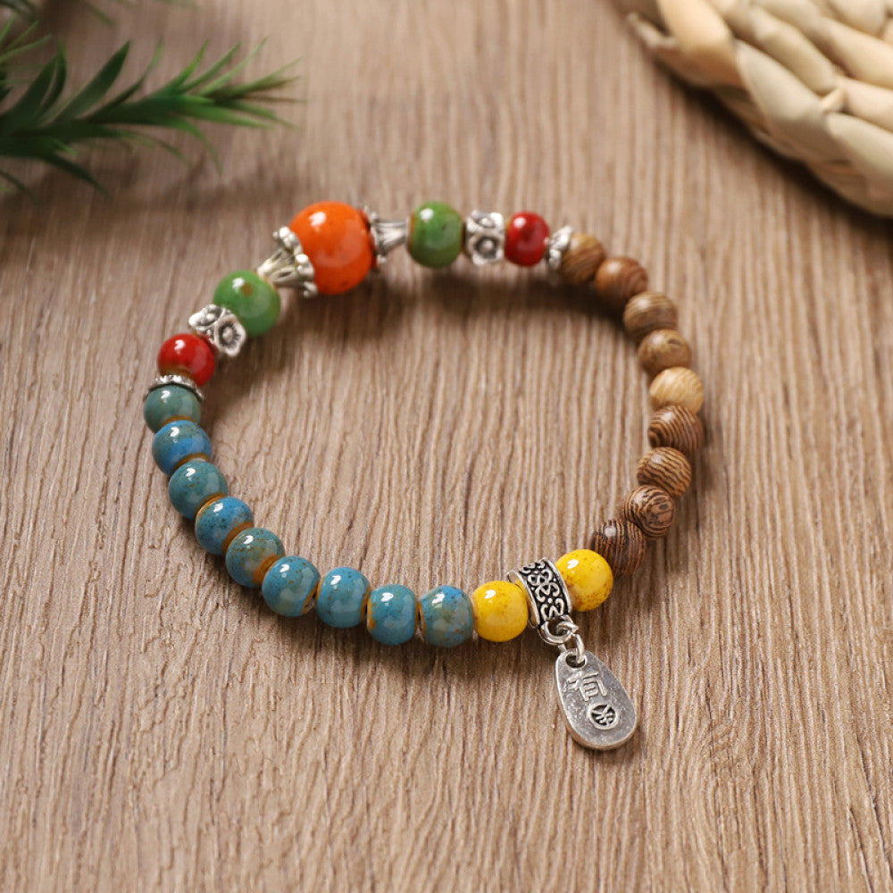 Turquoise and red beads with yellow accents, lively and bold.