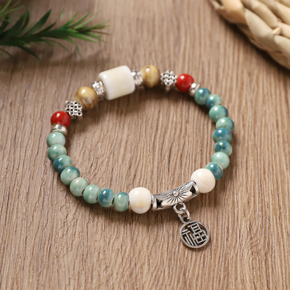 Turquoise and white beads with a silver tag, light and natural.