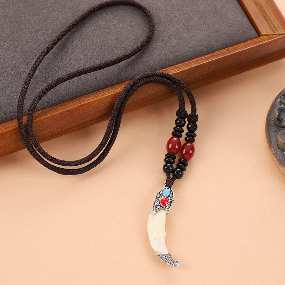 Vintage wolf tooth pendant necklace for men with tribal style metal wolf design and beaded cord 08