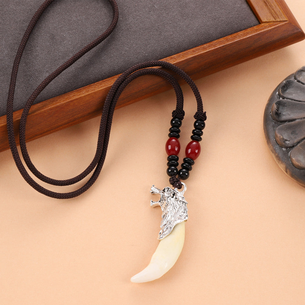 Vintage wolf tooth pendant necklace for men with tribal style metal wolf design and beaded cord 01