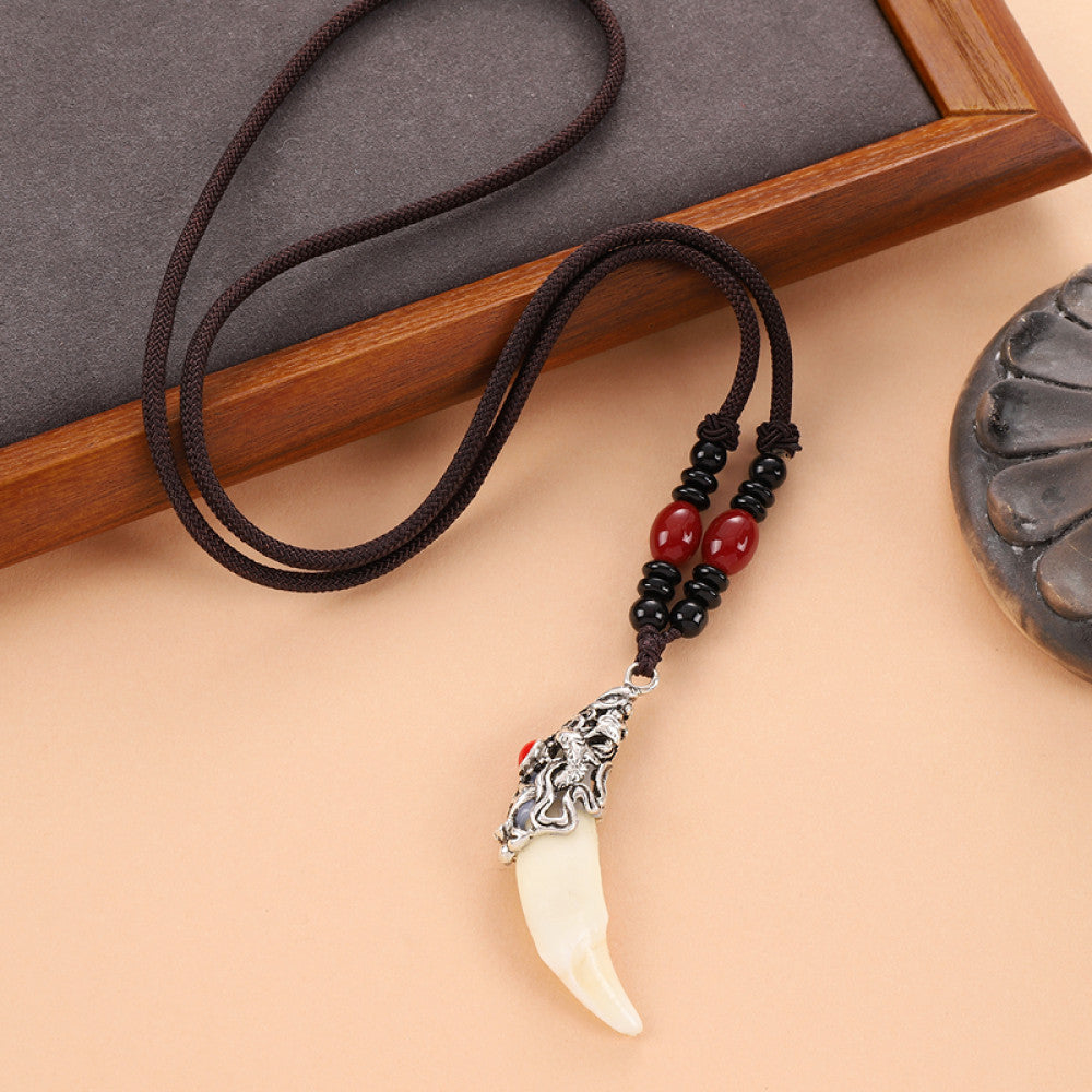 Vintage wolf tooth pendant necklace for men with tribal style metal wolf design and beaded cord 10