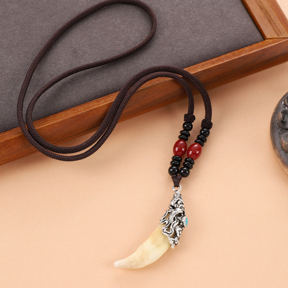 Vintage wolf tooth pendant necklace for men with tribal style metal wolf design and beaded cord 11