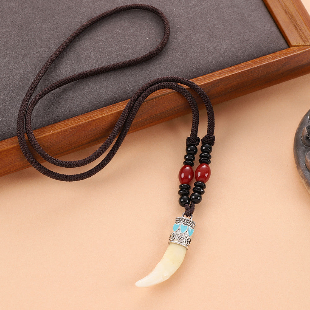 Vintage wolf tooth pendant necklace for men with tribal style metal wolf design and beaded cord 12