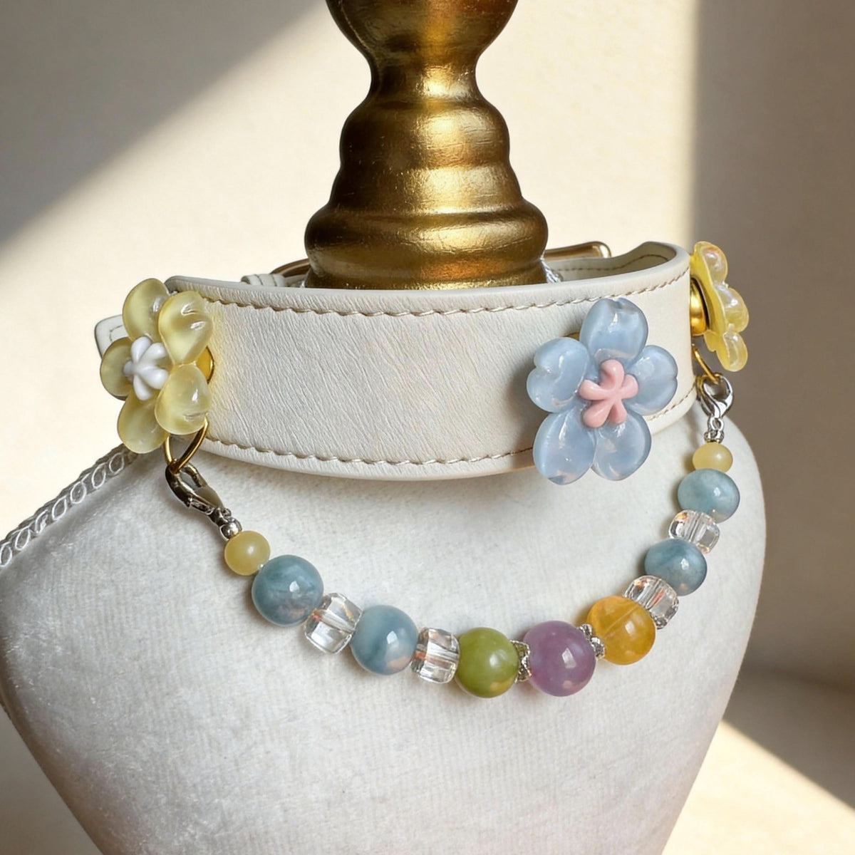 Side angle shot off-white leather pet collar decorated with blue sakura and translucent jade beads | DIY Jade