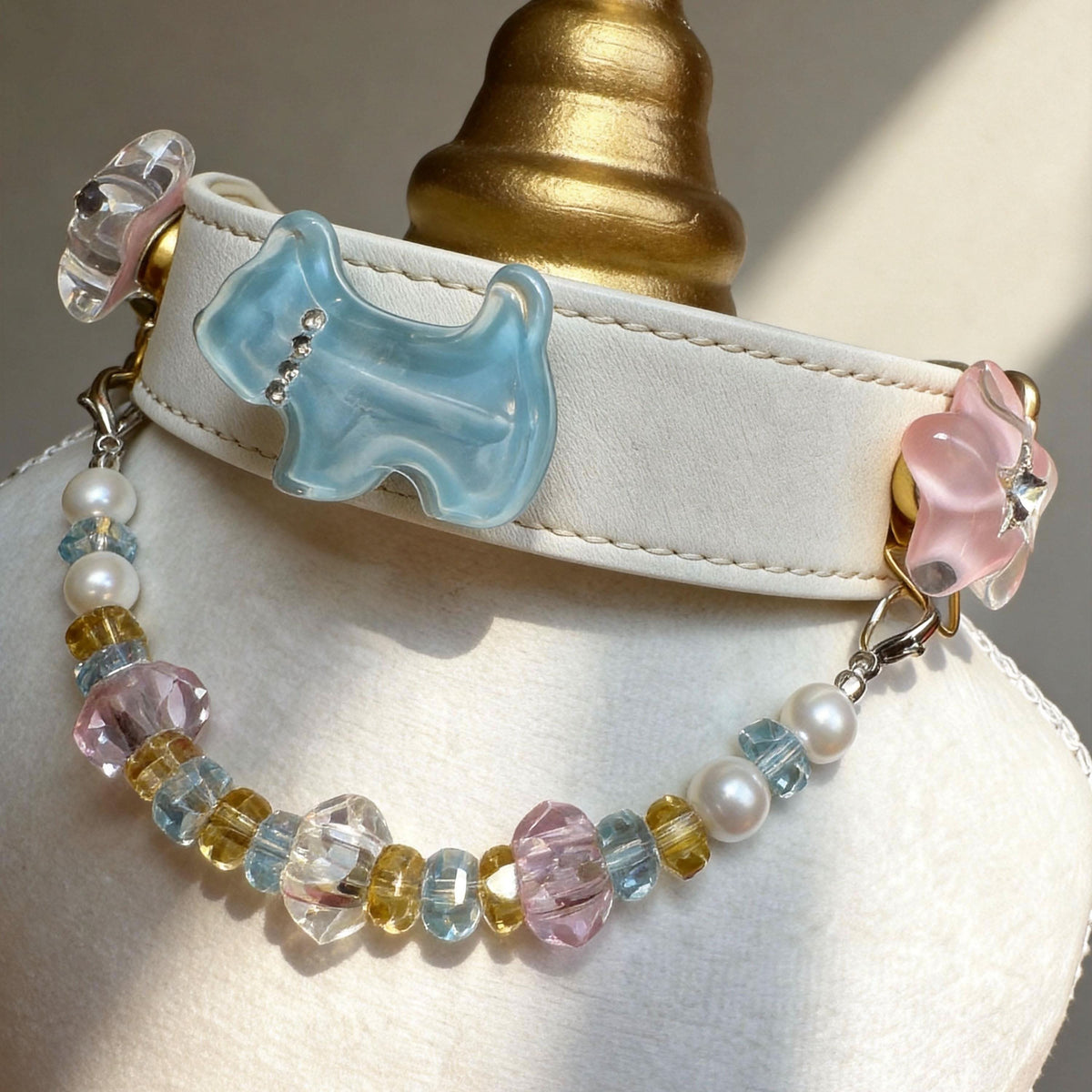 Close-up shot of white leather pet collar with blue bow and pink jade beads | DIY Jade