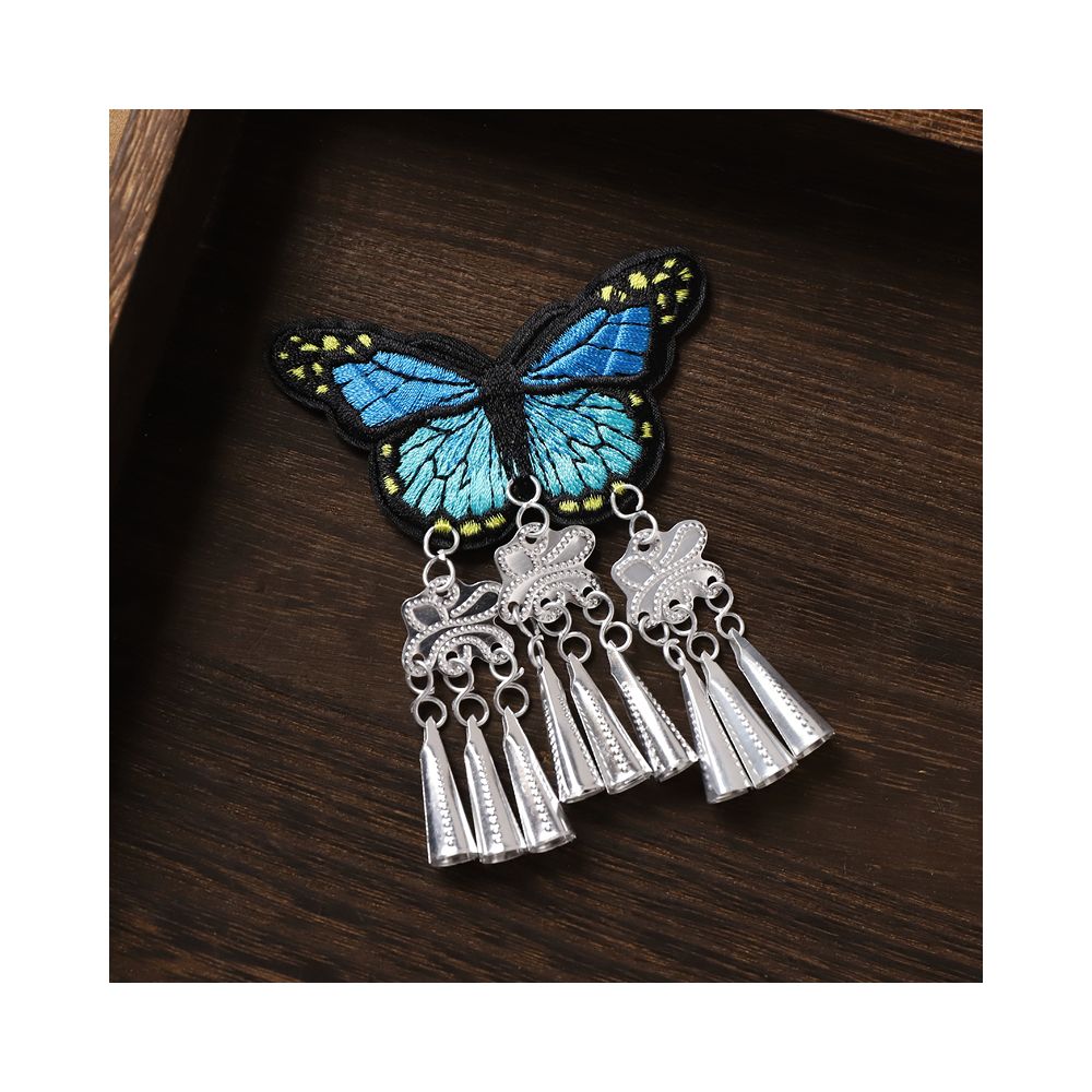 Blue butterfly earrings with silver tassel fringe design