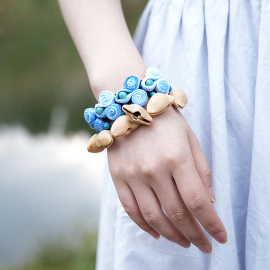Blue flower seed bracelet worn on wrist | DIY Jade