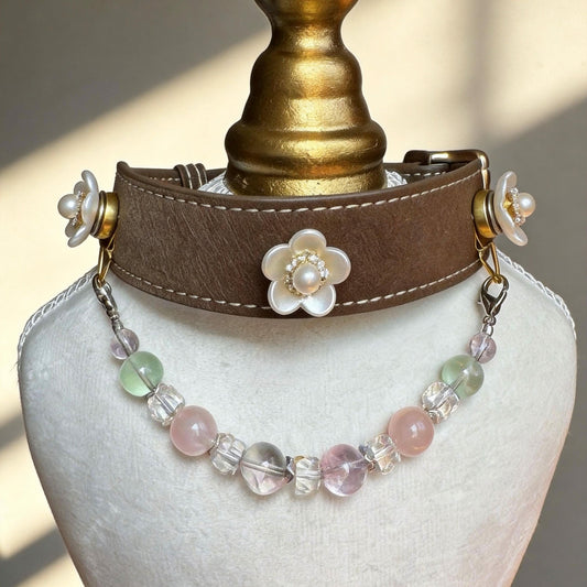 Brown leather pet collar closeup, decorated with white pearl flower ornaments and pastel pink green jade bead chain | DIY Jade