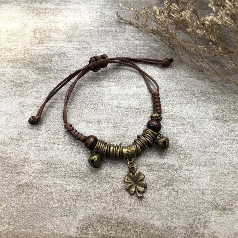 Boho woven bracelet with detailed bronze leaf charm | DIY Jade
