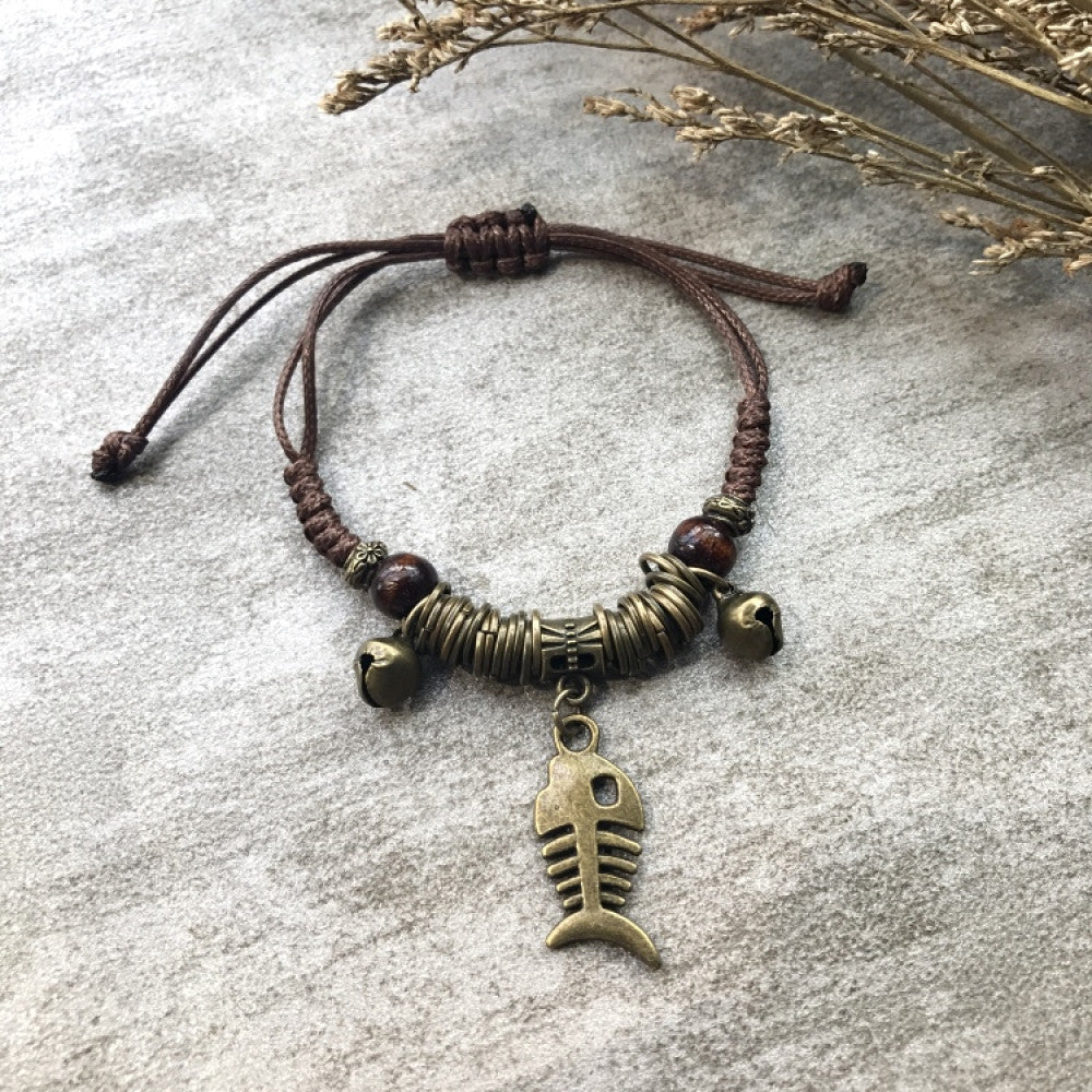 Woven brown bracelet with detailed bronze fishbone charm | DIY Jade
