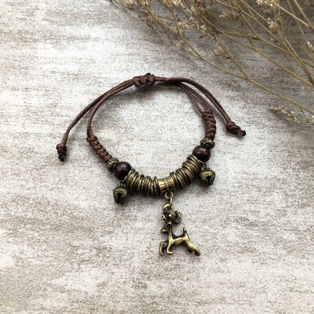 Woven brown bracelet with tiny bronze arrow charm | DIY Jade

