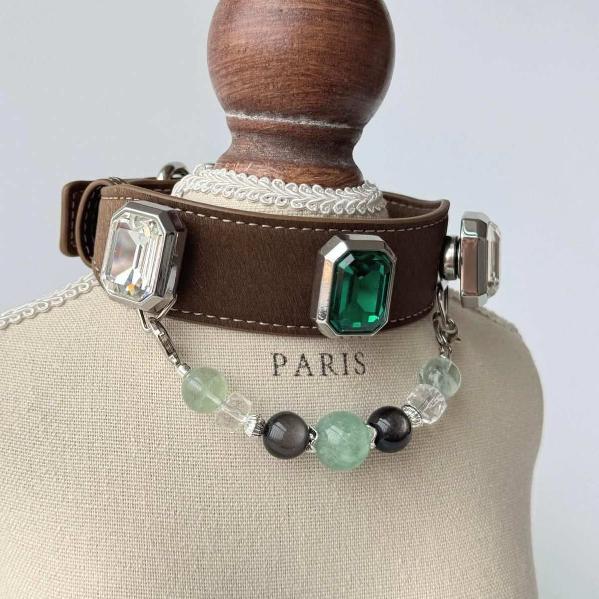 Brown leather pet collar with green gem ornament and bead chain on display bust | DIY Jade