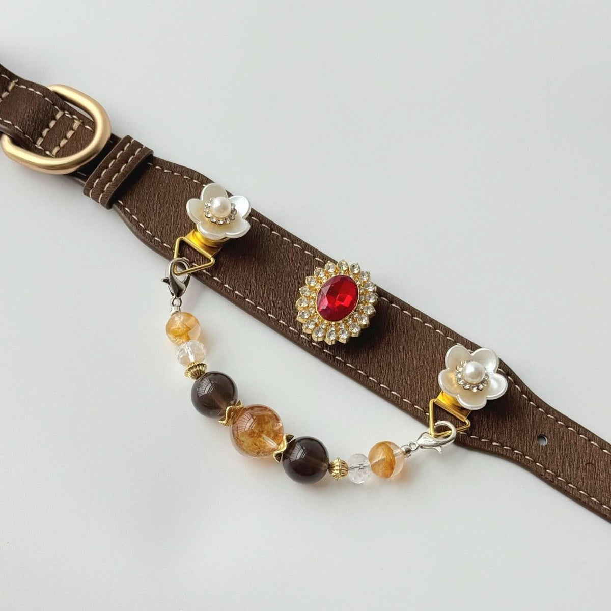 Brown pet collar with red gem charm, white rose ornament and earth‑tone bead drop chain | DIY Jade
