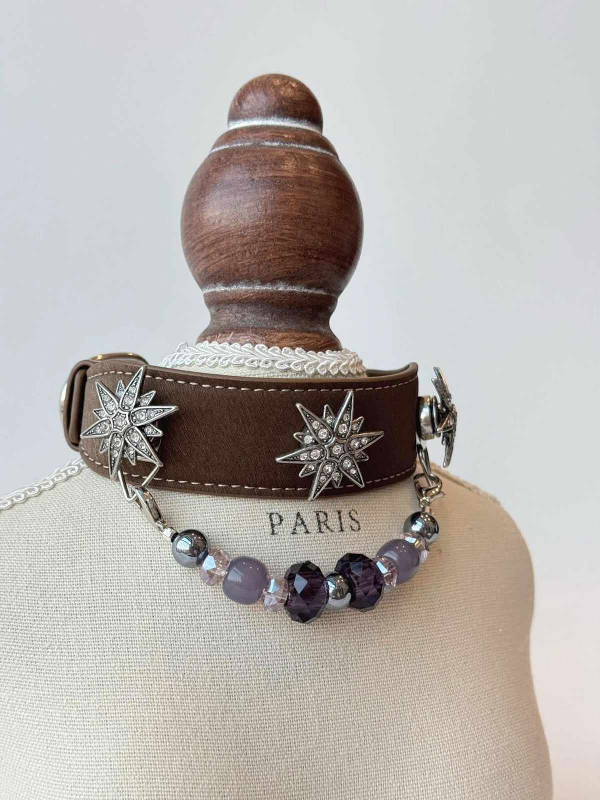 Brown pet collar with star crystal charms and purple bead drop chain on display bust | DIY Jade
