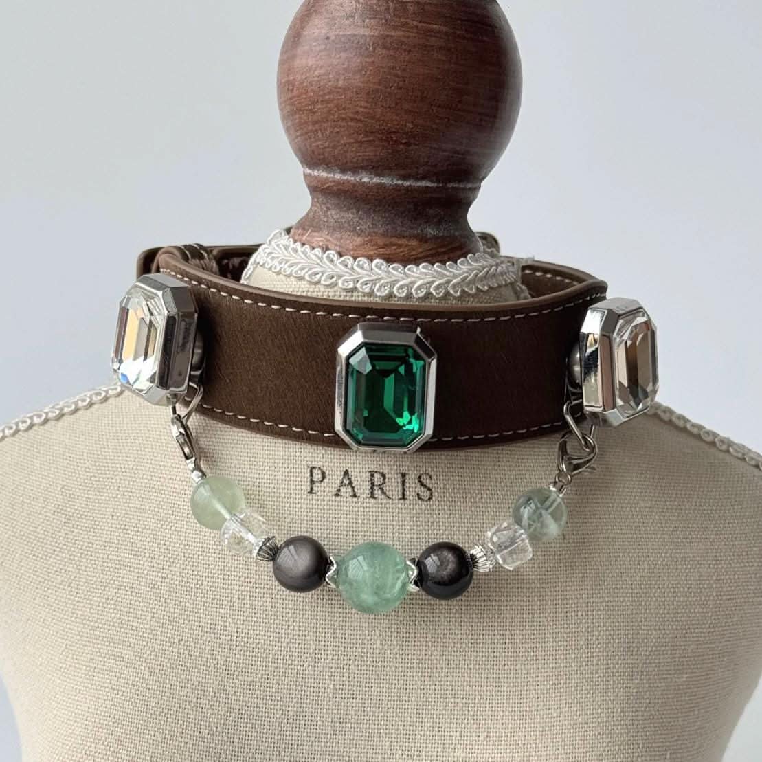 Cavalier King Charles Spaniel wearing an emerald gemstone brown leather pet collar, front view | DIYJade