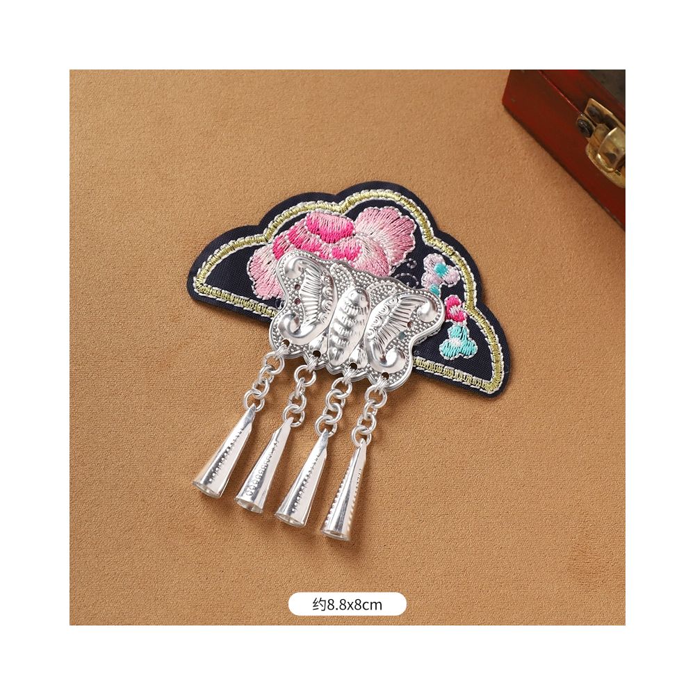 Cloud embroidered tassel brooch close-up