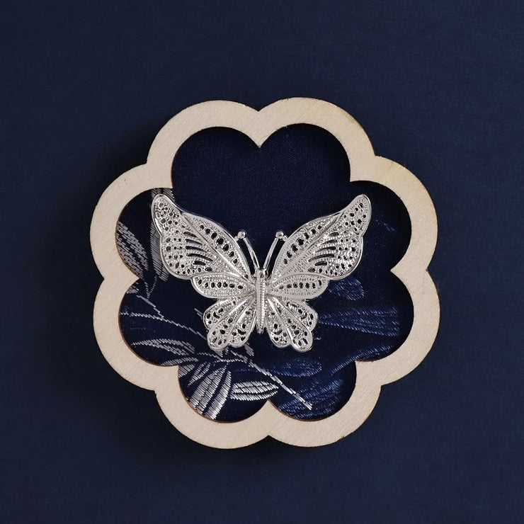 Clover shape fridge magnet, black background butterfly embroidery Miao‑style craft