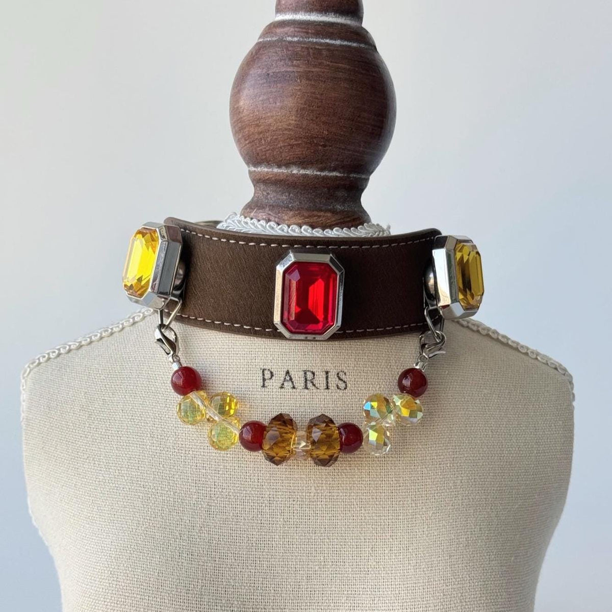 Side view of a gemstone pet collar on display — iridescent crystal charm style|DIYJade