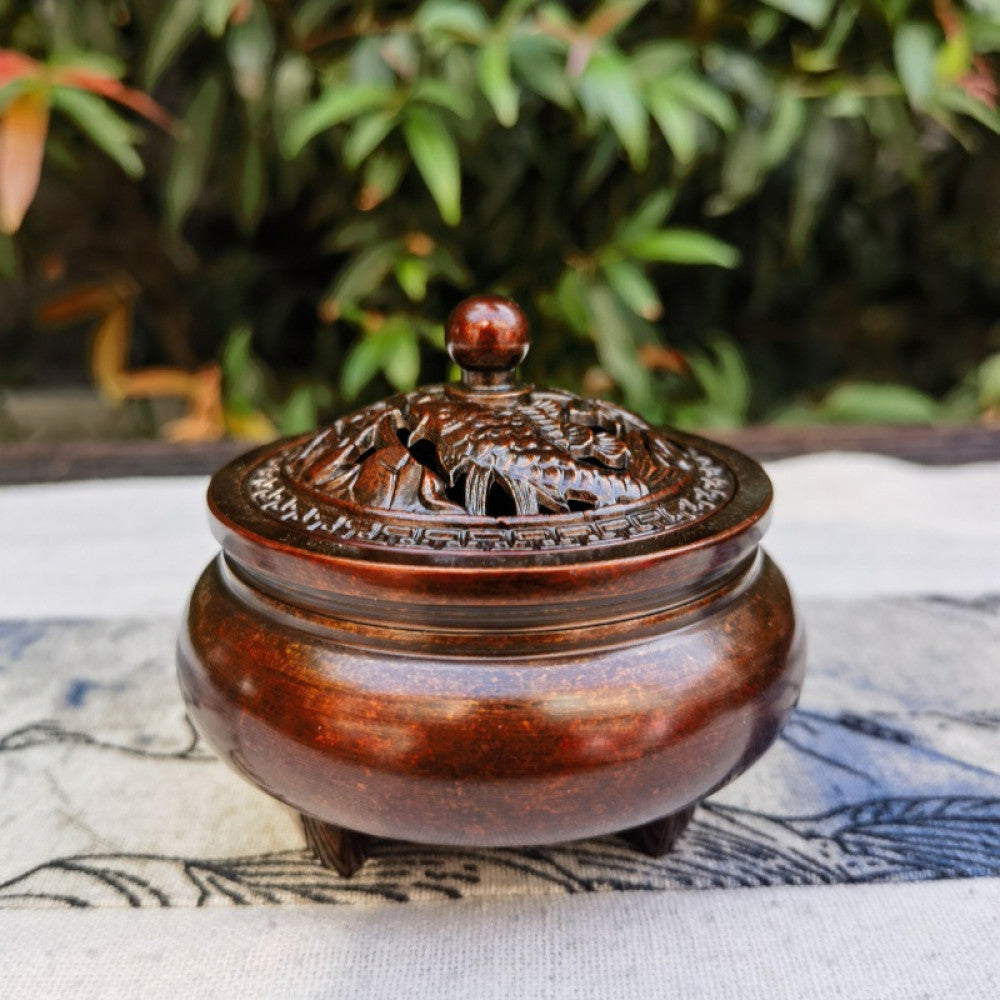 Dark reddish-brown incense burner with carved lid, outdoor lifestyle shot | DIY Jade