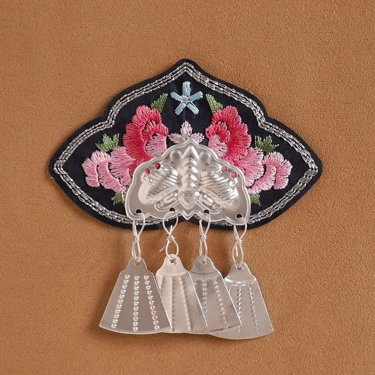 Dark background embroidered applique, pink floral pattern with short silver tassel trims
