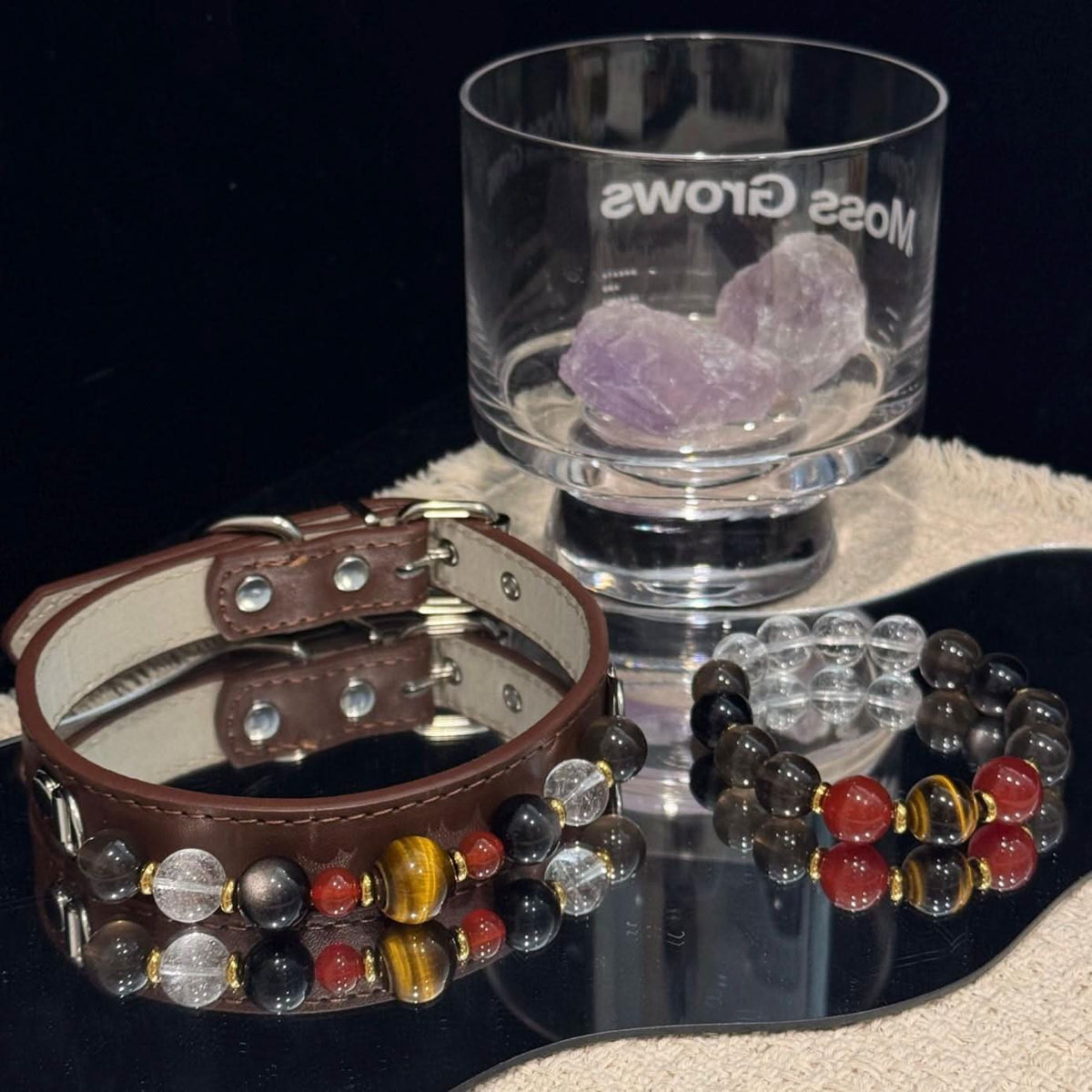 Dark leather pet collar‑bracelet set arranged with crystal glass decor on table | DIY Jade