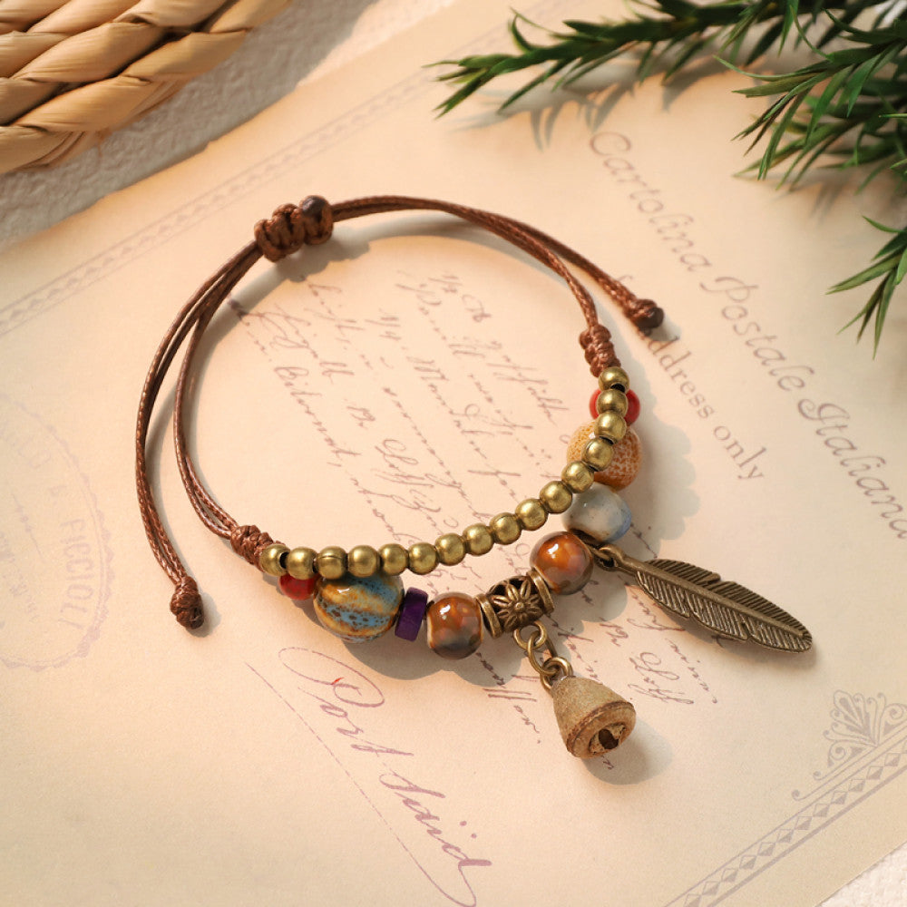Adjustable bracelet with feather and double charm details | DIY Jade