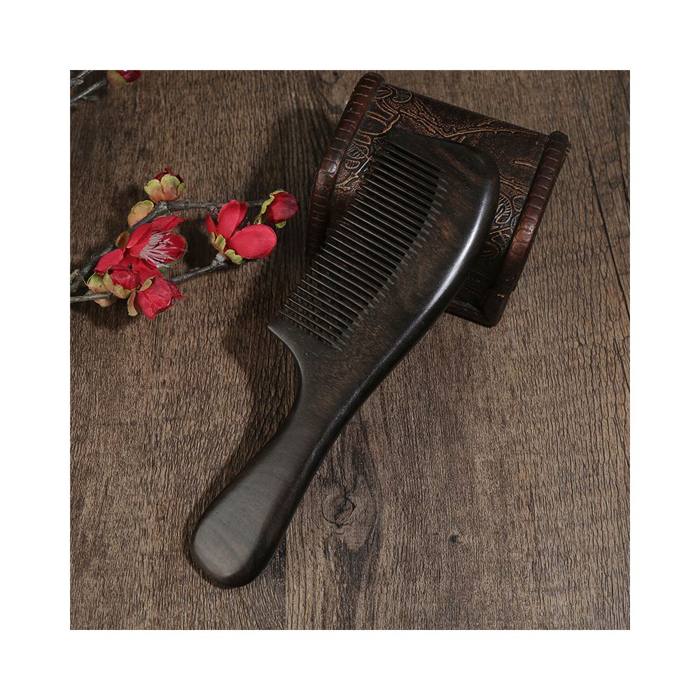 Close up of ebony wood hair comb handle texture
