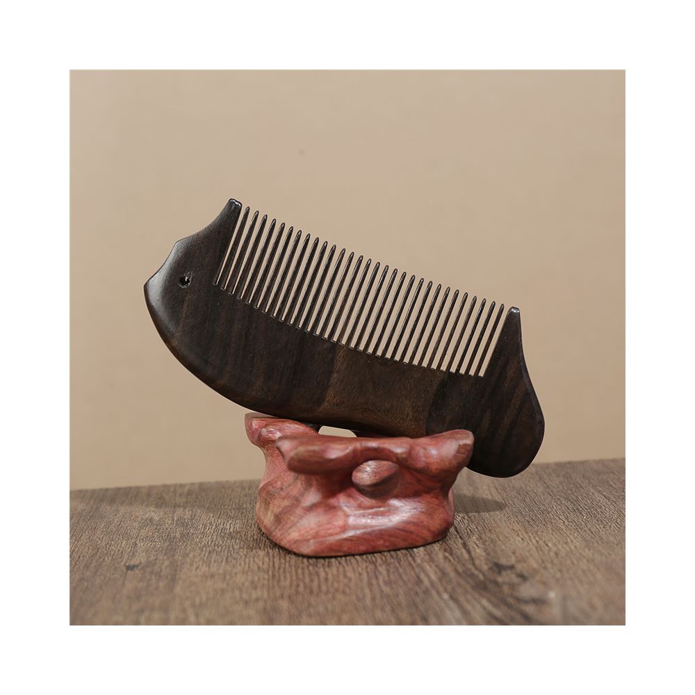 Back detail of ebony wooden hair comb