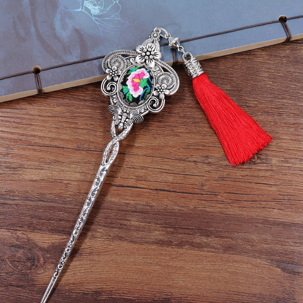 silver tone hair stick earring set featuring ornate details, a colorful accent