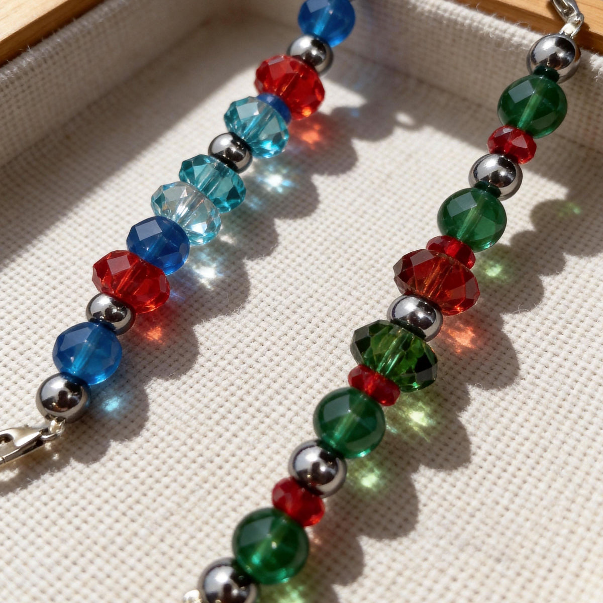Festive red‑green‑blue faceted crystal detachable bead chains for pet collars flat lay | DIY Jade