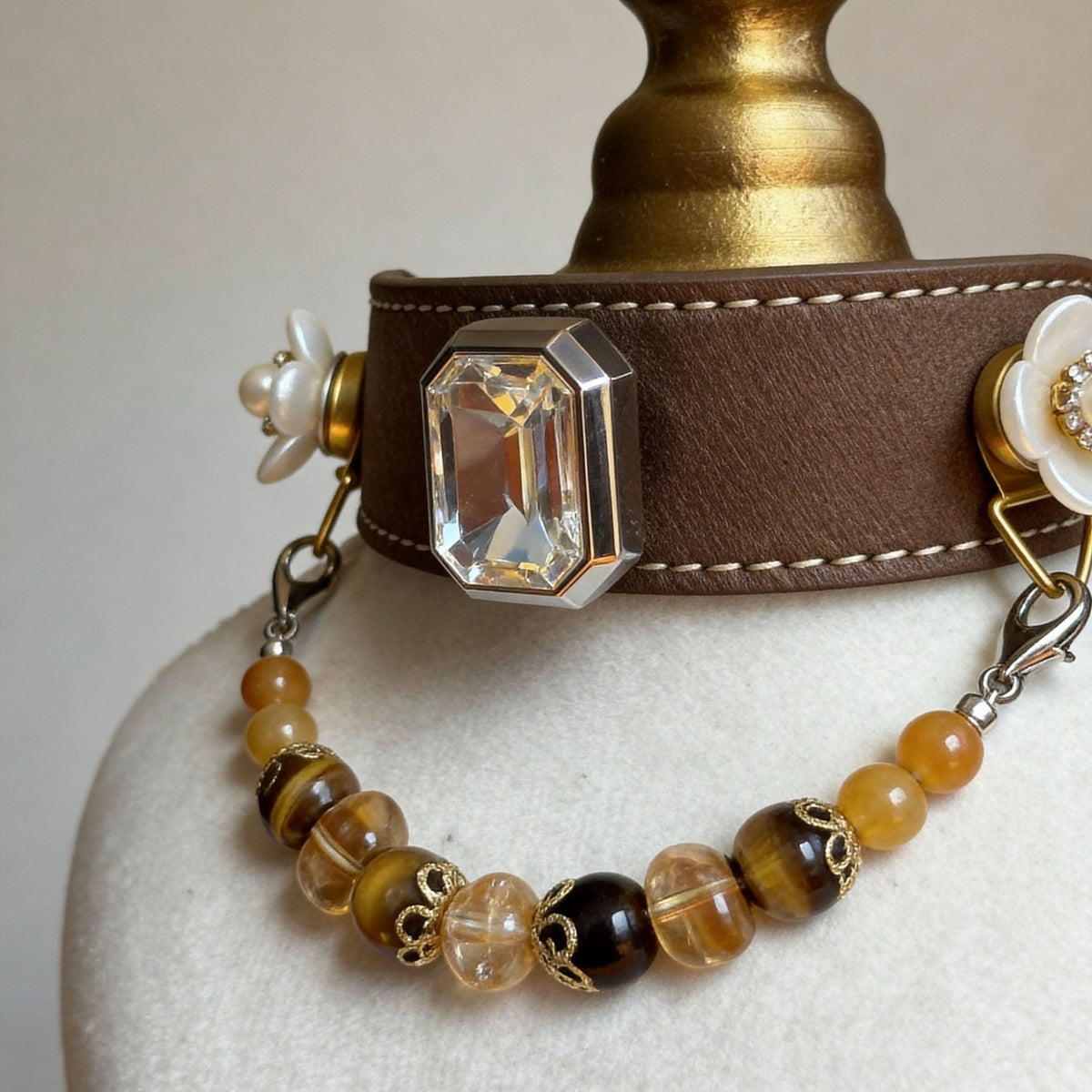 Front display of brown leather pet collar with flower ornaments and amber jade beads | DIY Jade