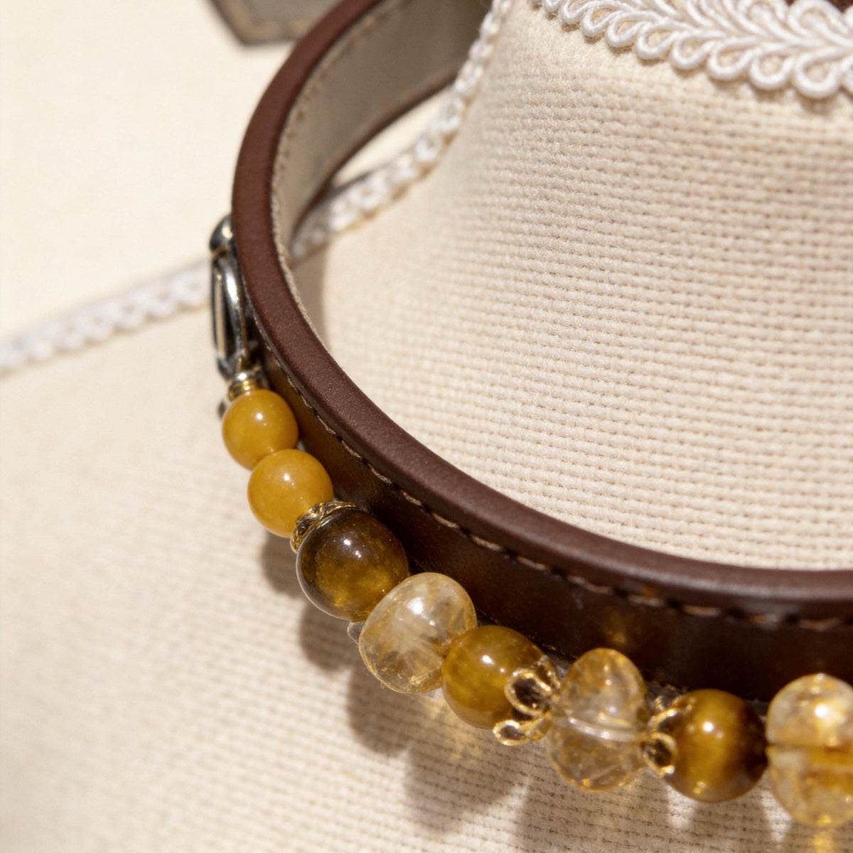 Close‑up detail shot of brown leather collar with golden tiger‑eye beads | DIY Jade