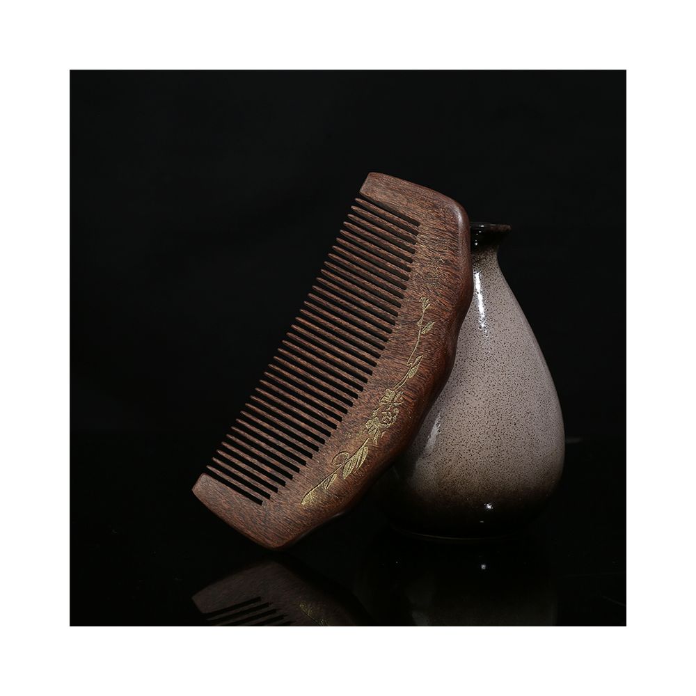 Hand carved wooden hair comb with gold pattern