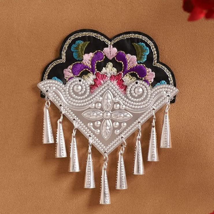 Large pointed‑top Miao embroidery patch, purple floral motif with cone‑shaped silver tassels