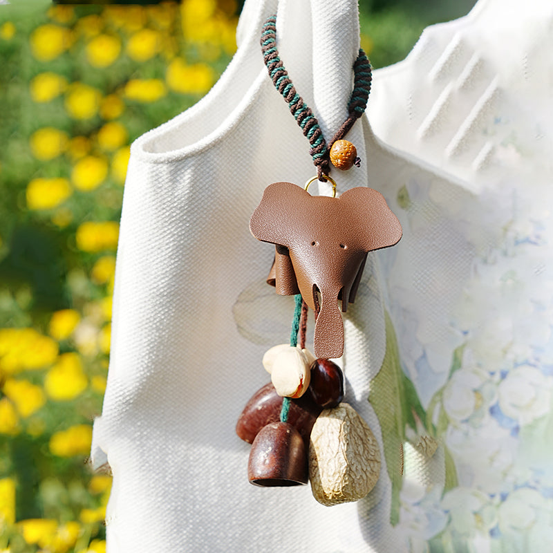 Leather accent seed pod bag charm against yellow wildflower scenery | DIY Jade