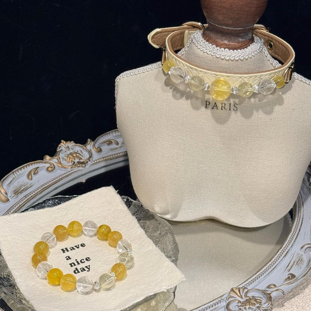 Matching owner and pet crystal set with collar on mannequin bust and yellow fluorite bracelet on display tray | DIYJade