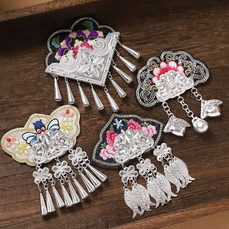Assortment of Miao ethnic embroidered patches with silver tassel charms, folk craft supplies