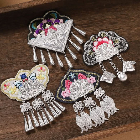 Assortment of Miao ethnic embroidered patches with silver tassel charms, folk craft supplies