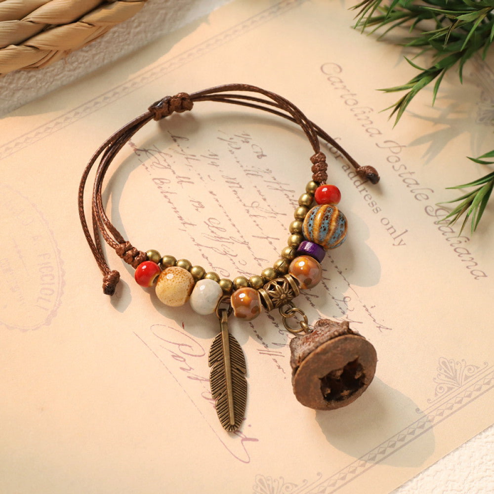 Ethnic bracelet with mini bell charm and feather pendant | DIY Jade

